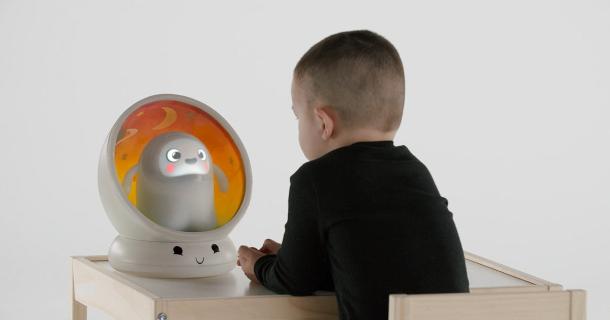 baby sound machine, Boy sitting in front of Snorble